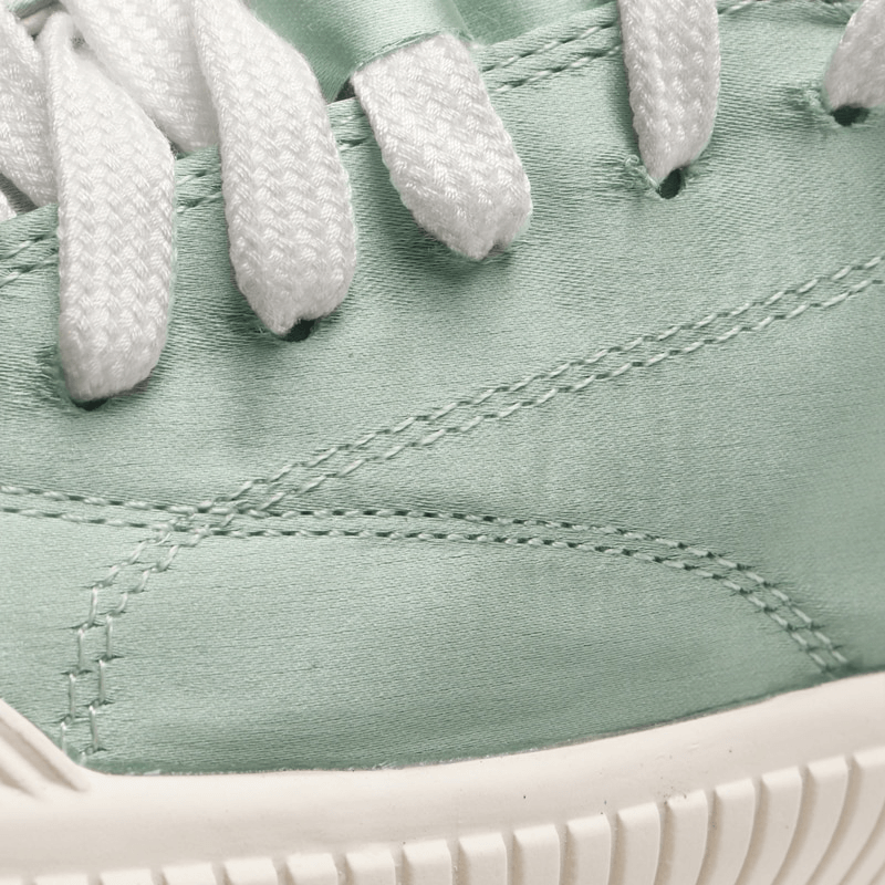 Close-up of Women's Casual Sports Shoes SF1008 with lace-up design and thick sole in mint green color.